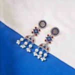 Elegant oxidized silver-tone metal dangle earrings with a three-layered geometric design, delicate enamel detailing, and pearl dangles, secured with a push-back closure