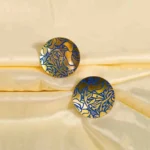 Lightweight and elegant snake chain bracelet with silver-tone finish, beaded details, a dangling heart charm, and a bell-inspired charm, secured with a lobster claw clasp.