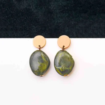 Chic oval marble drop earrings with a sleek round design, accented by a gold-tone top and finished with a push-back closure