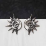 Intricately crafted oxidized C-hoop earring with floral detailing, offering a vintage charm, and finished with a push-back closure.