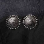Statement oxidized silver-tone circular stud earring with an elaborate intricate design, highlighted by a beaded border for a classic touch, finished with a push-back closure