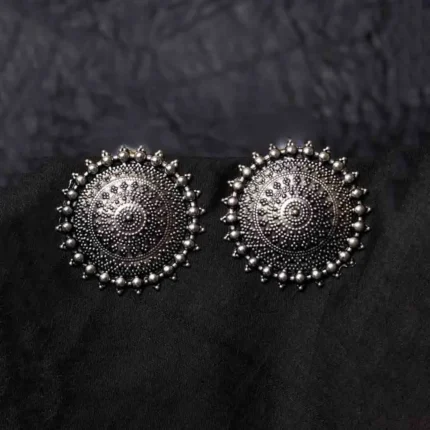 Statement oxidized silver-tone circular stud earring with an elaborate intricate design, highlighted by a beaded border for a classic touch, finished with a push-back closure
