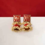 Vintage-inspired oxidized silver jhumka earring with an intricately detailed circular top, chain tassel layers, and small ghungroo embellishments and a push back closure.