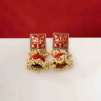 Vintage-inspired oxidized silver jhumka earring with an intricately detailed circular top, chain tassel layers, and small ghungroo embellishments and a push back closure.