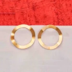 Minimalist brass earrings with an irregular design, subtle texture detailing, and a classic push-back closure