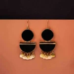 Unique handcrafted bohemian drop earring with a gold-tone frame, black wooden accents, a sleek gold bar, and shell charms, secured with a curved hook.