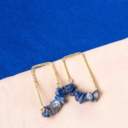Elegant rectangular metal hoop earrings featuring a textured gold/navy blue finish and irregular marble-textured blue stones, completed with a push-back closure.