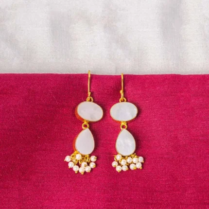 Chic teardrop-shaped metal drop earrings with a gold/moss green finish, showcasing a raw gemstone in an earthy gray and brown mix with a soft shimmer, and a curved hook closure