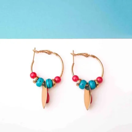Chic metal hoop earrings featuring a polished gold-tone finish, playful enamel accents, and dangling golden and red charm ,a push back for easy wear.