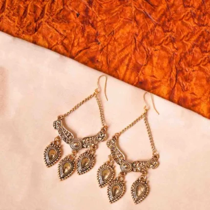 Stylish geometric metal dangle earrings with a silver finish along with colorful enamel detailing, delicate chain tassels with circular beads, and a push-back closure.