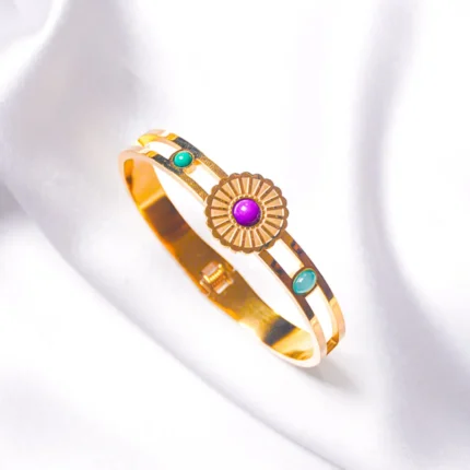 Graceful hinged bracelet with a golden-tone finish, designed with a delicate flower design adorned with purple, green, and teal blue gemstones