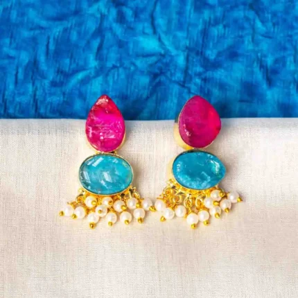 Chic teardrop-shaped metal drop earrings with a gold/aqua blue finish, showcasing a raw gemstone in an blue colored oval shaped druzy with series of a small pearl beads, and a push back closure.