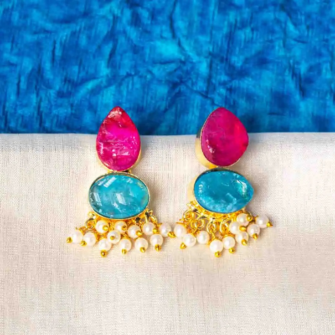 450-Th Chic teardrop-shaped metal drop earrings with a gold/aqua blue finish, showcasing a raw gemstone in an blue colored oval shaped druzy with series of a small pearl beads, and a push back closure.
