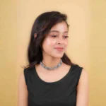 Classic choker necklace adorned with a series of detailed circular patterns, creating an artistic and bold look with an S-hook clasp.