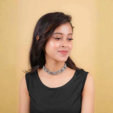 Classic choker necklace adorned with a series of detailed circular patterns, creating an artistic and bold look with an S-hook clasp.