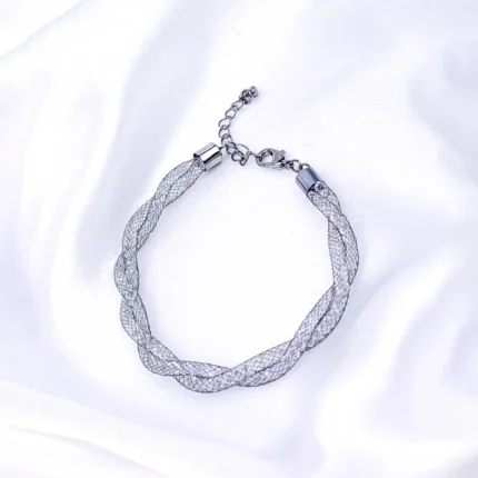 Refined and lightweight interwoven metal wire bracelet with shimmering crystals inside, secured with a lobster clasp for a secure fit.