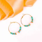 Multicolor beaded hoop earrings with pink, yellow, purple, and orange accents.