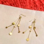 Chic geometric brass earrings with a lightweight design, featuring three slinging stem-like wires adorned with evenly spaced circular discs, secured with a French hook.