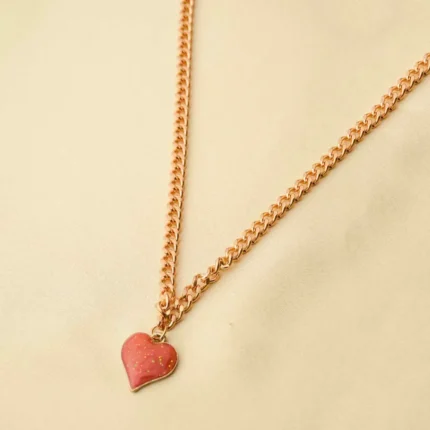 Elegant adjustable curb chain bracelet in a gold-tone finish, featuring a curved metallic wire centerpiece with a dangling spherical charm and a secure spring ring clasp.