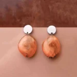 Chic oval resin drop earrings with a sleek geometric design, accented by a gold-tone top and finished with a push-back closure.