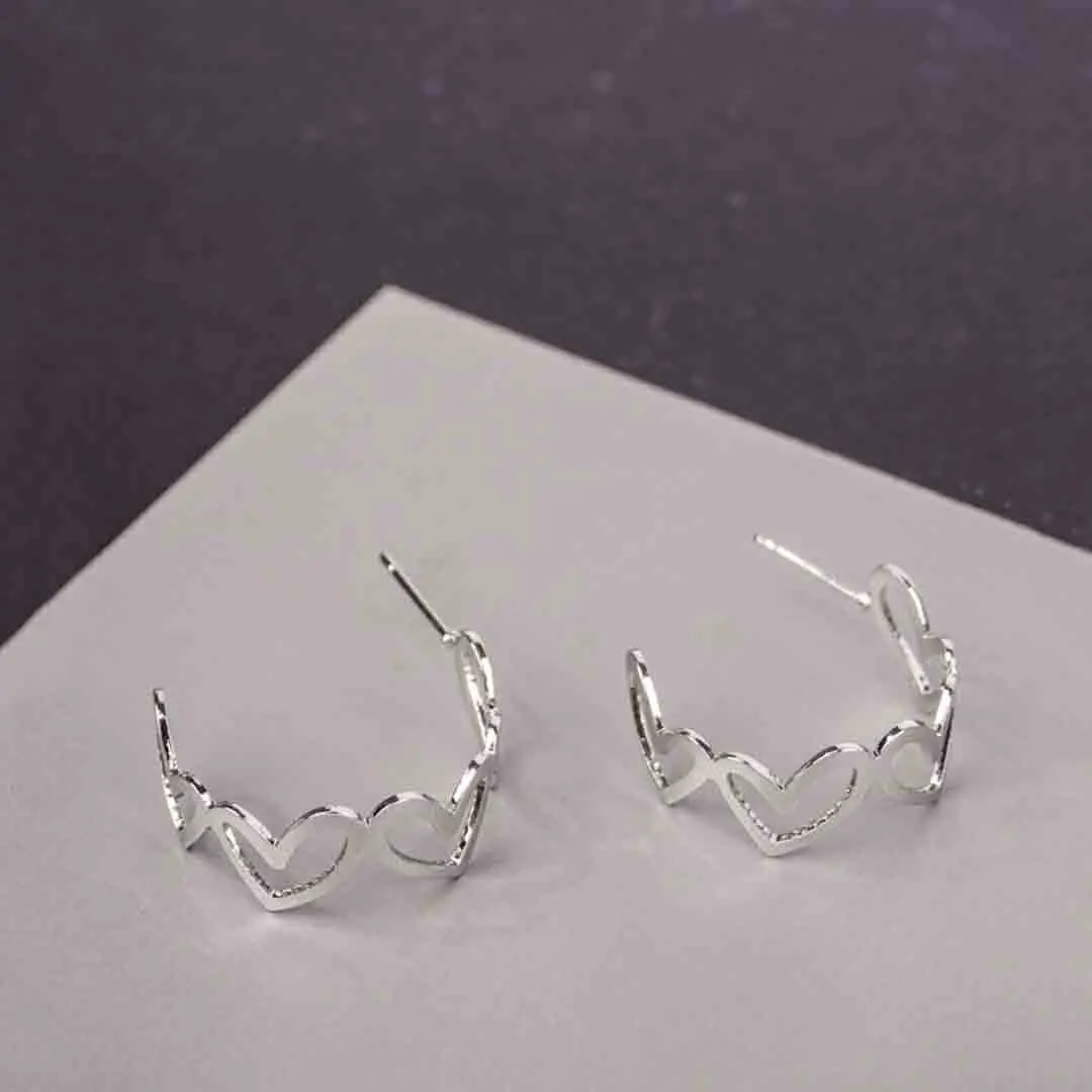 _DSC2810 (1) Trendy mini C-hoop earring with a polished silver-tone, heart shapded and , push-back post.