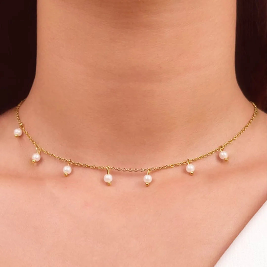 th - 2026-01-17T122811.881 Elegant adjustable curb chain bracelet in a gold-tone finish, featuring a curved metallic wire centerpiece with a dangling spherical charm and a secure spring ring clasp.