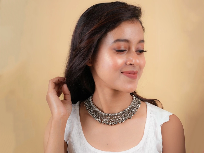 Elegant flatlay of oxidised jewelry including layered necklaces, jhumkas, bangles, and rings styled with ethnic and Western outfits – perfect for every occasion 22