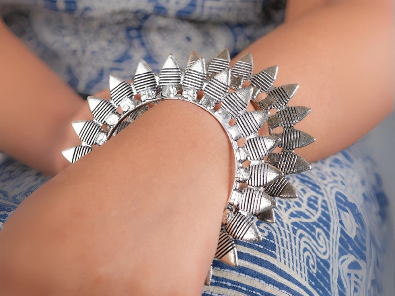 Elegant flatlay of oxidised jewelry including layered necklaces, jhumkas, bangles, and rings styled with ethnic and Western outfits – perfect for every occasion 23