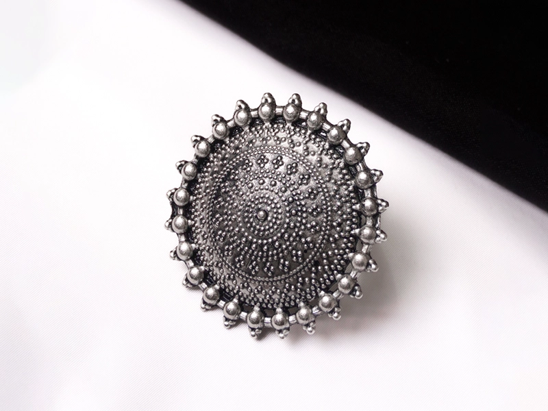 Elegant flatlay of oxidised jewelry including layered necklaces, jhumkas, bangles, and rings styled with ethnic and Western outfits – perfect for every occasion 16