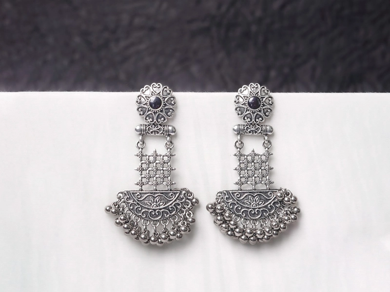 Elegant flatlay of oxidised jewelry including layered necklaces, jhumkas, bangles, and rings styled with ethnic and Western outfits – perfect for every occasion 6