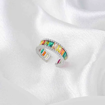 Silver-tone ring with rectangular multicolour stones and beaded borders in an open adjustable design.