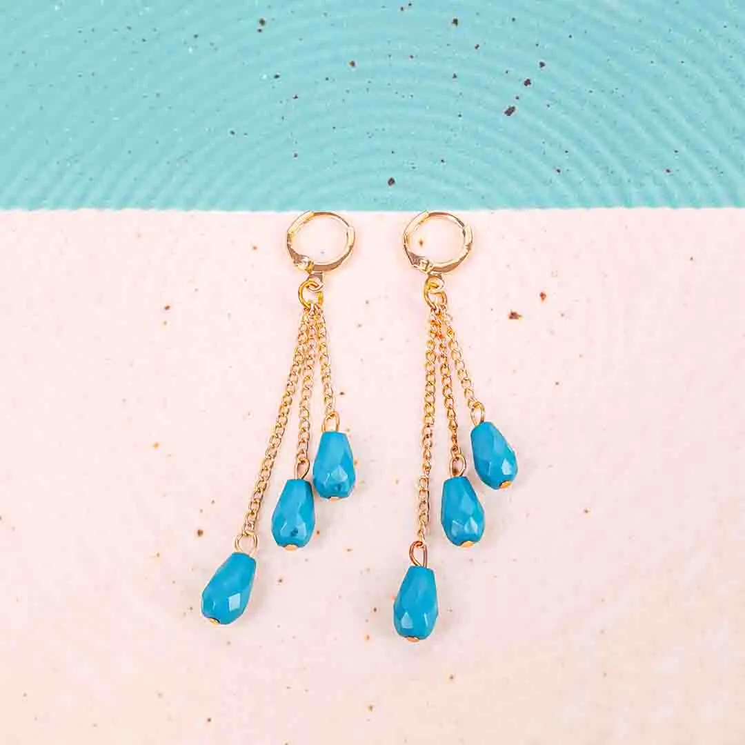 20251104_135613 Drop earrings with faceted gemstone charms and chain strands, attached to display cards with hoop clasp closure.