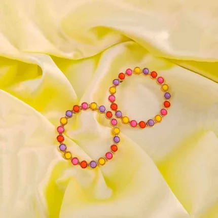 Multicolor beaded hoop earrings with pink, yellow, purple, and orange accents.