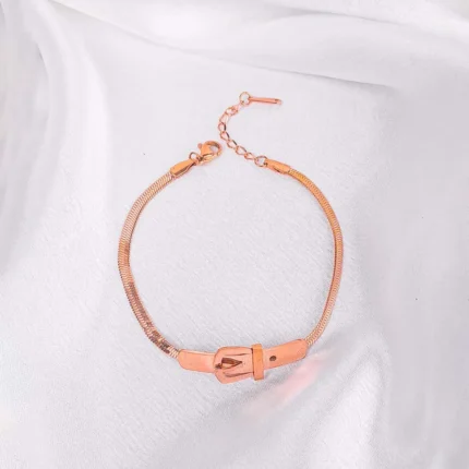 Rose gold mesh bracelet with clasp and adjustable chain.