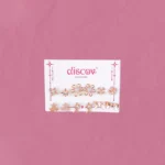 Starfall Mini Stud Pack featuring gold-toned studs in floral, leaf, and crystal designs.