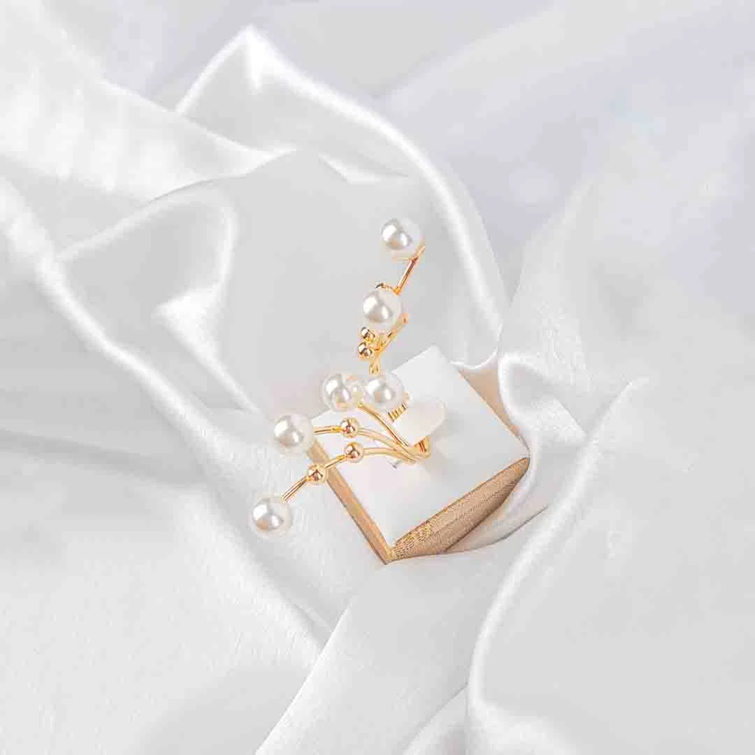 20251101_133029 Multi-band adjustable ring with delicate pearl accents on slender metallic branches, polished to a refined finish.