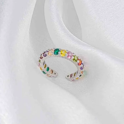 Silver-tone open ring with multicolour faceted gemstones in a gradient layout and adjustable fit.