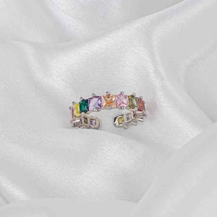 Silver-tone ring with multicolour faceted gemstones in a clustered design and adjustable open fit.
