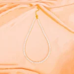 Classic single-strand pearl bead necklace with a gold adjustable clasp, showcasing a polished, elegant finish for a timeless look.