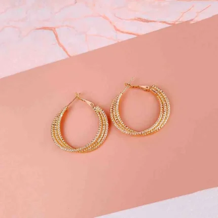 Beaded texture hoop earrings with elegant detailing.